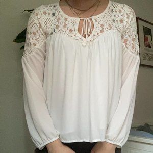 white flowy blouse with floral